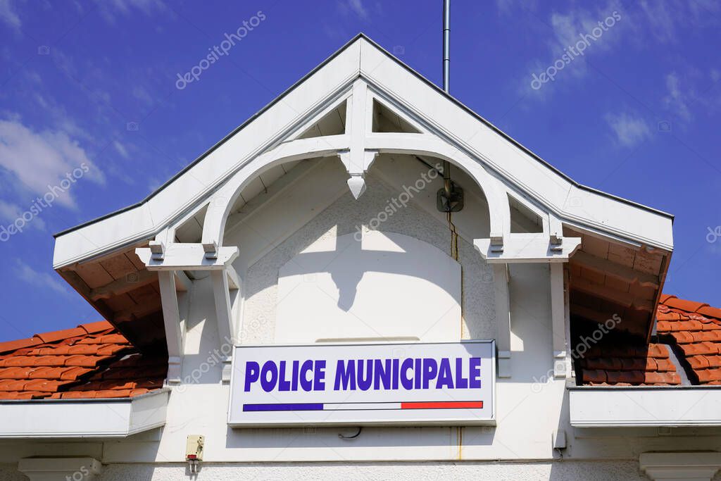 police municipale means in french Municipal police in official building in city with logo text sign