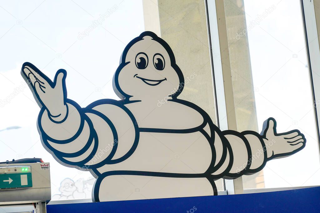 Clermont-Ferrand , auvergne / France - 08 10 2020 : bibendum michelin sign shop logo of tyres dealership stock car french