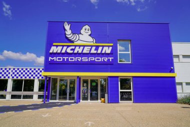 Clermont Ferrand , auvergne / France - 09 23 2019 : Michelin motorsport logo and text sign front of headquarter of tires manufacturer sport brand based in Clermont Ferrand France clipart
