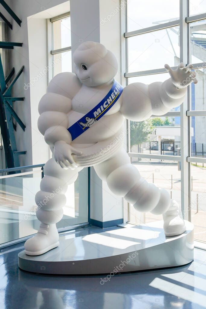 Clermont-Ferrand, , Auvergne / France - 09 01 2020 : bibendum michelin sign shop logo statue of tyres dealership