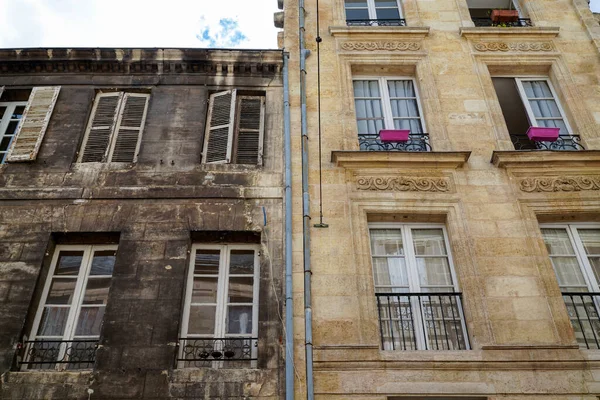 Comparison building before and after cleaning front facades with difference between clean house facade washing and dirty one