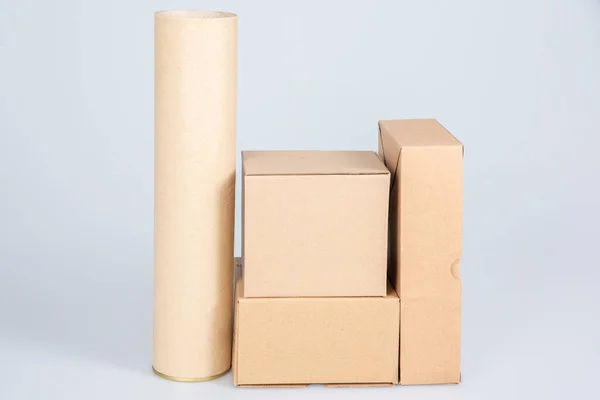 piles of many cardboard boxes and tube on a white background