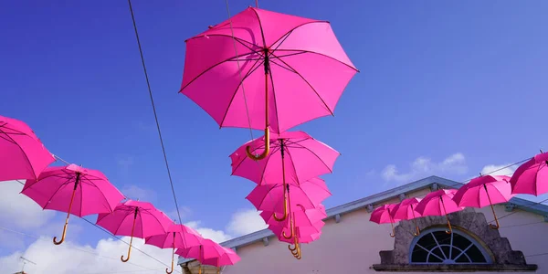 Pink umbrellas in artistic street decorated — Stock Image Pink Umbrellas Artistic Street Decorated Stock Photo