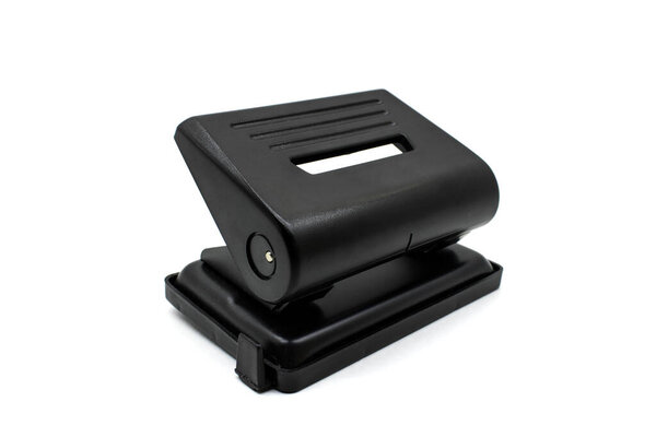Metal hole punch in black on a white background