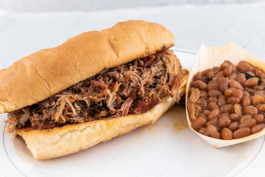 BBQ meal of pulled pork, baked beans, and butter toasted bread will taste as delicious as it looks.