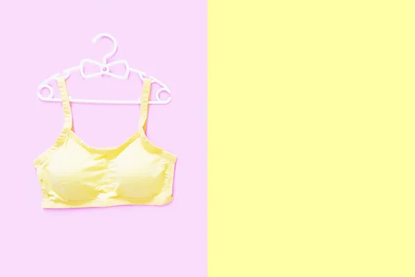 Top View Sportswear White Hanger Women Yellow Sports Bra Isolated — Stock Photo, Image