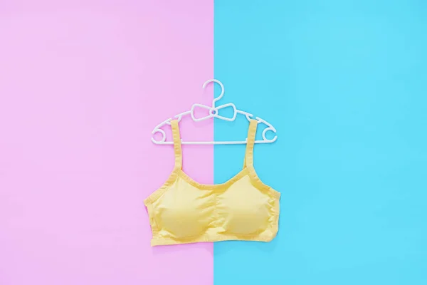 Top View Sportswear White Hanger Women Yellow Sports Bra Isolated — Stock Photo, Image