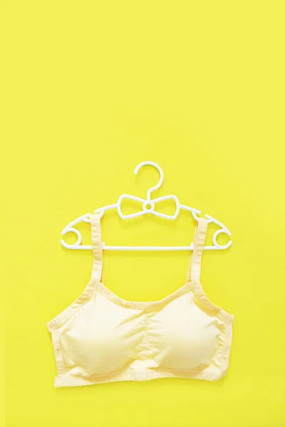 Top View Sportswear White Hanger Women Yellow Sports Bra Isolated — Stock Photo, Image