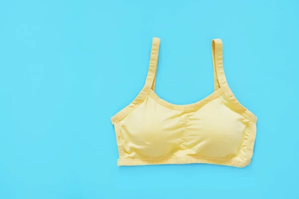 Top View Sportswear Clothing Women Yellow Sports Bra Isolated Blue — Stock Photo, Image