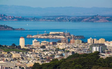 Aerial view of Alcatraz island with Angel Island in the background view. Landmark of San Francisco city, California, USA clipart