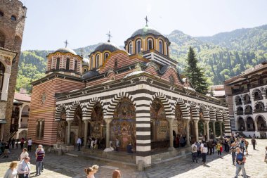 Rila, Bulgaria - 29 April 2018: Rila Monastery of Saint Ivan of Rila, better known as the Rila Monastery is the largest and most famous Eastern Orthodox monastery in Bulgaria. clipart