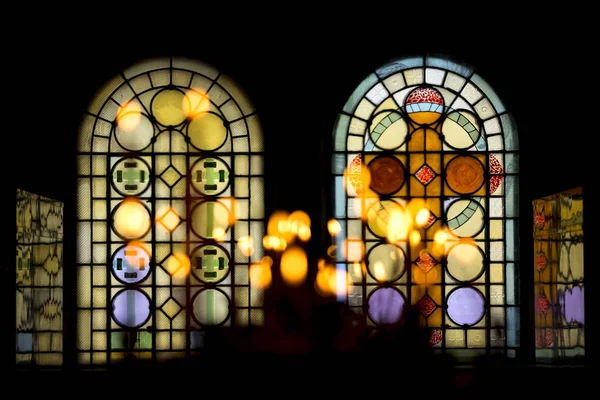 Stained Glass Window Church Isolated Black Vackground Lighted Candles Foreground — Stock Photo, Image