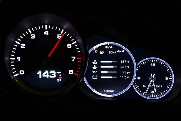 Modern light car mileage on black background — Stock Photo, Image