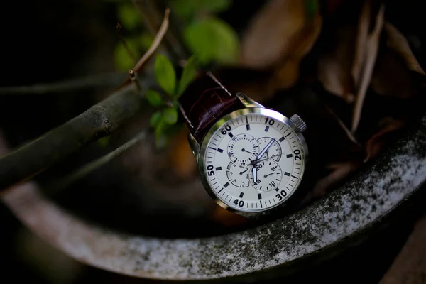 businessman checking time on his wrist watch, man putting clock on hand,groom getting ready in the morning before wedding ceremony