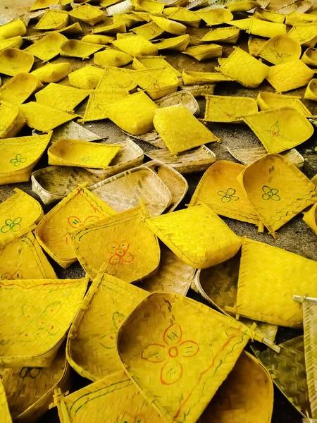Beautiful and colourful handmade winnowing fans in bamboo market in india