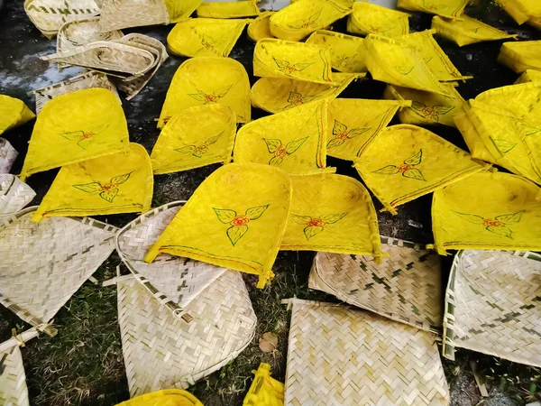 Beautiful and colourful handmade winnowing fans in bamboo market in india