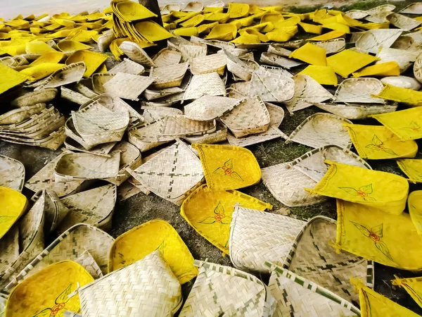 Beautiful and colourful handmade winnowing fans in bamboo market in india