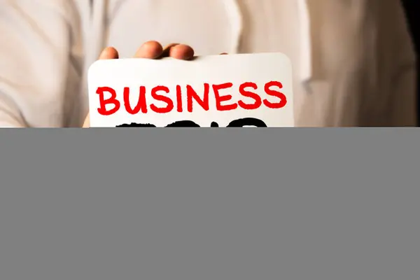 Businessman Holding Card Text Business Trip — Stock Photo, Image