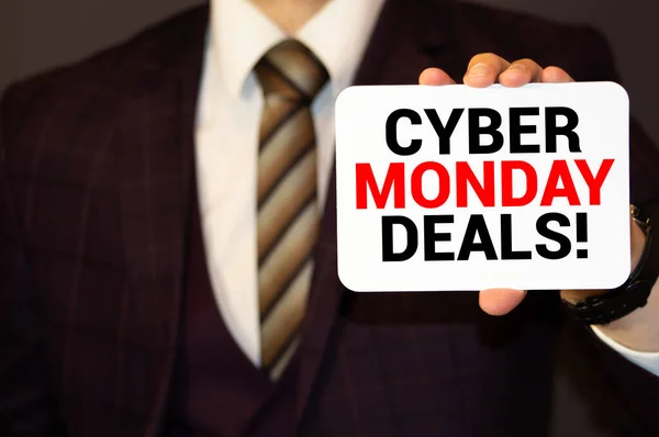 Man holding a card with the text Cyber monday on white background — Stock Photo, Image