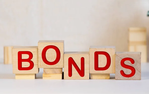 米ドル紙幣の木製ブロックのWord Bonds ヴィンテージカラー — ストック写真