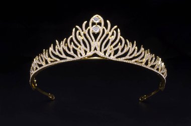 gold diadem with diamonds isolated on black clipart