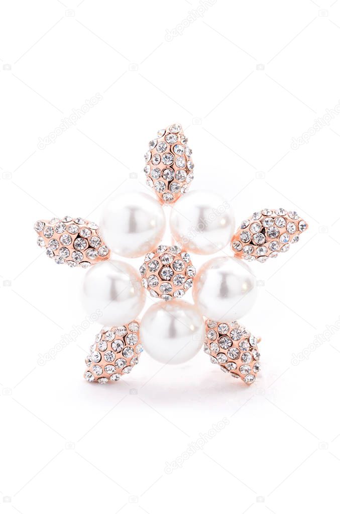 Brooch with pearl on a white background