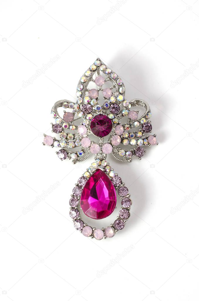 Brooch with pink diamonds isolated on white