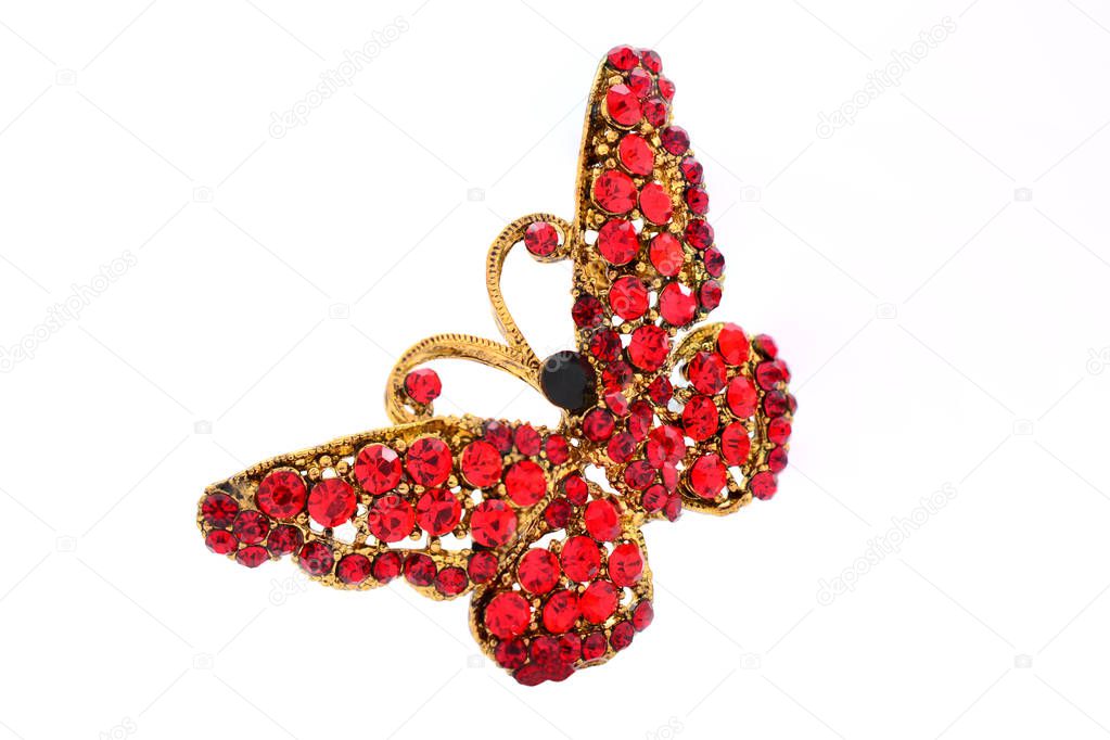 brooch in the form of a butterfly on a white background
