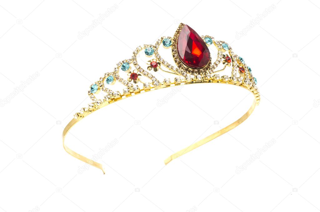 gold crown with red ruby stone isolated on white