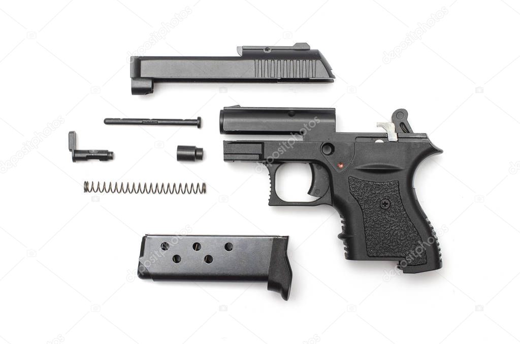 disassembled gun on a white background