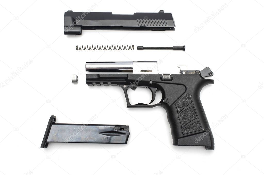 disassembled gun on a white background