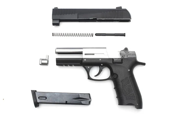 白い背景の上の逆アセンブルされた銃 — ストック写真