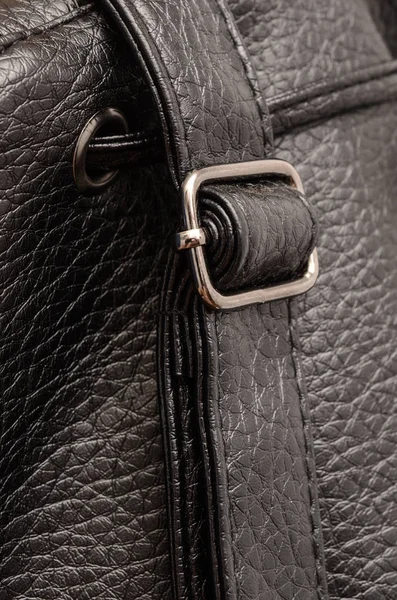Black leather backpack detail, strap