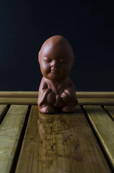Clay boy figurine for Chinese tea ceremony — Stock Image Clay Boy Figurine Chinese Tea Ceremony Royalty Free Stock Images