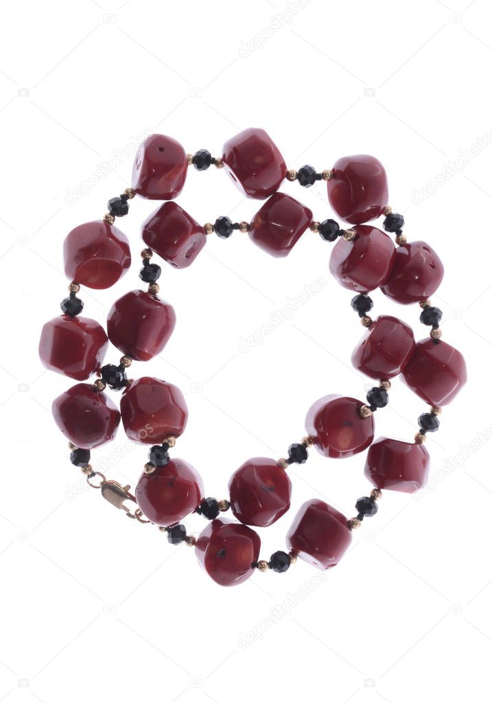 necklace with red beads on a white background