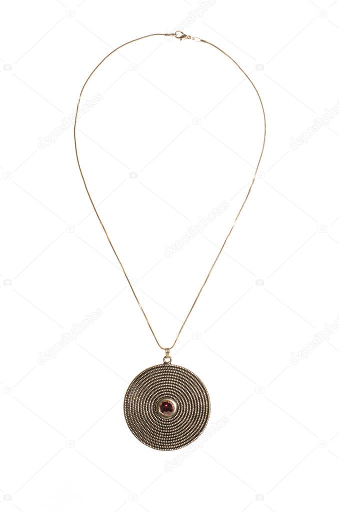 Gold round pendant with ruby on white background