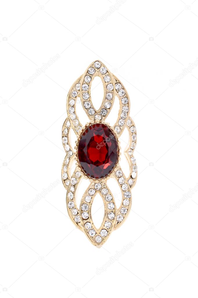 gold brooch with ruby on white background