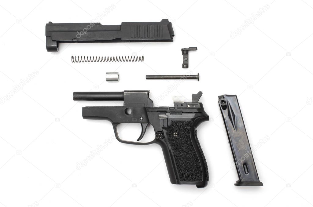 disassembled gun on a white background