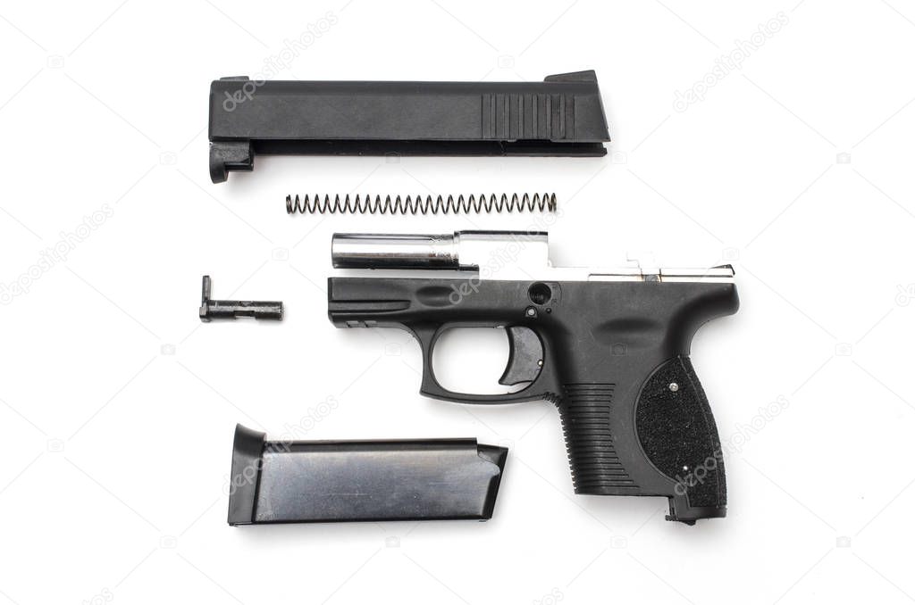 disassembled gun on a white background