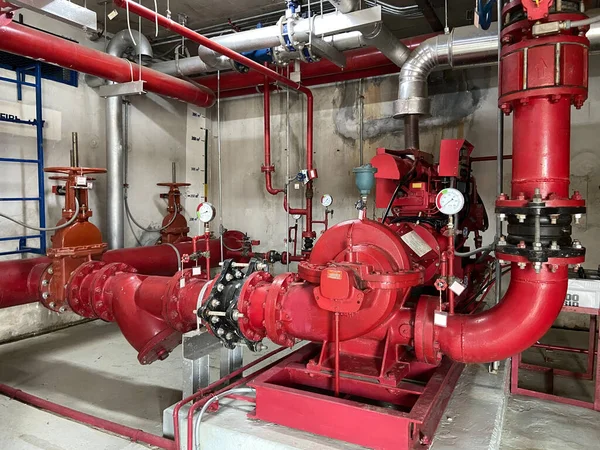 Pump rooms, pipes and valves in large industrial pumping stations