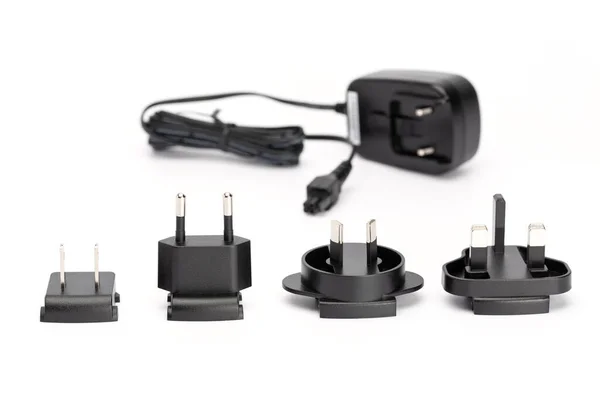 Four Black Interchangeable Plugs Europe Australia Great Britain Black Plug — Stock Photo, Image