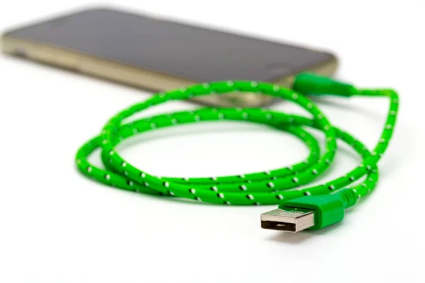 Green Rolled Usb Charging Cable Connected Blury Smartphone Background — Stock Photo, Image