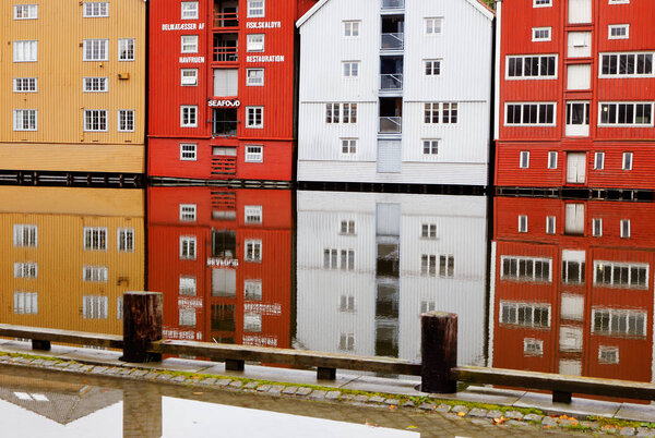 Trondheim, Norway - September 30, 2016: Buildings reflections in the river in the city center.