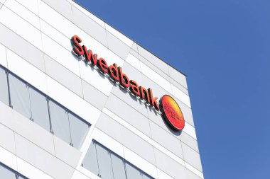 Sundbyberg, Sweden - May 9, 2016: Detail of the Swedbank head office with its logo. clipart