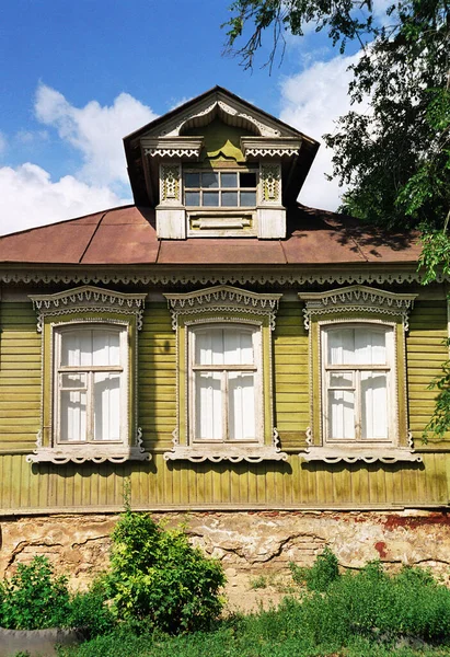 Facade of old Russian wooden house from times of Russian Empire. There are carved decorations on facade decor. Architecture of European part of Russia (southern city). For various reasons, these old houses are getting smaller and smaller every year.