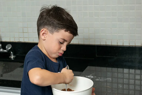 Boy Mixing Cookie Tough Metal Spoon Photo — стоковое фото