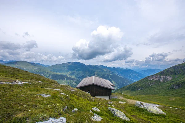 mountain hut in the mountains, landscape in the austrian mountains, swiss alpine village, alpine hut in the mountains, house in the mountains