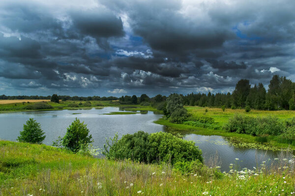 Dramatic, storm clouds hung over the river.