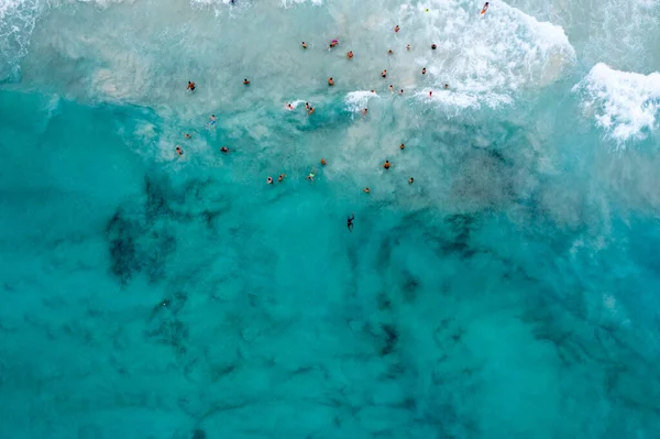 aerial view of people swimming in the Bay of Cala Agulla Majorca Spain