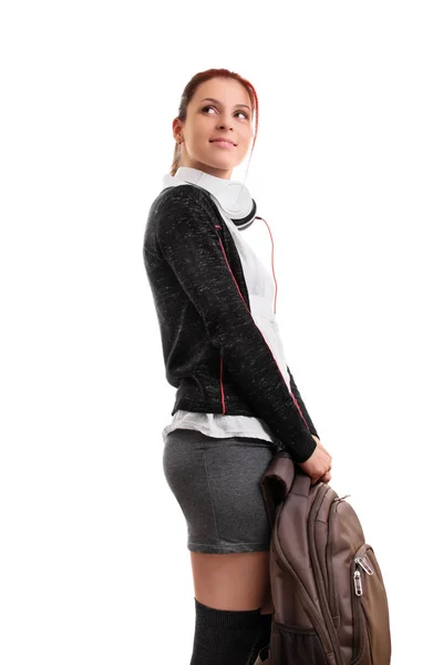 Atrakcyjny uczeń ze słuchawkami i plecakiem — Zdjęcie stockowe